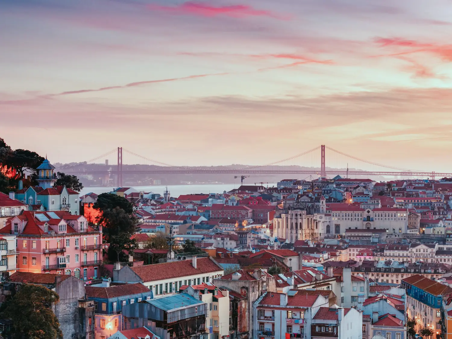 View over Lisbon from the observation deck at sunset.