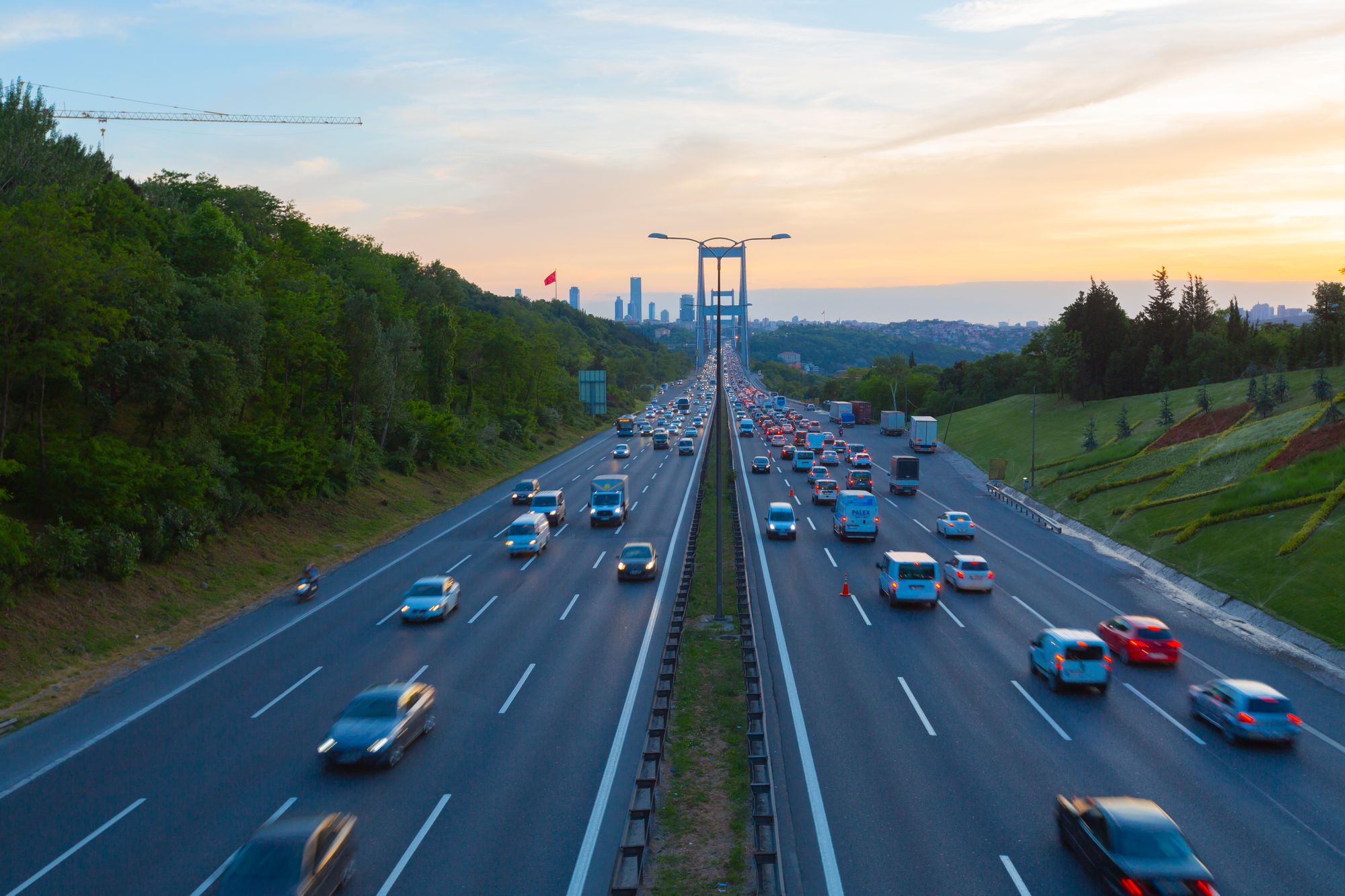 Cars on a modern highway and sunset