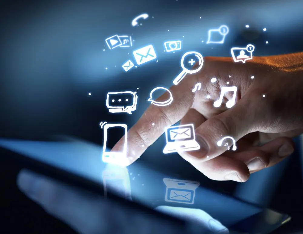 Finger with exploding icons from phone