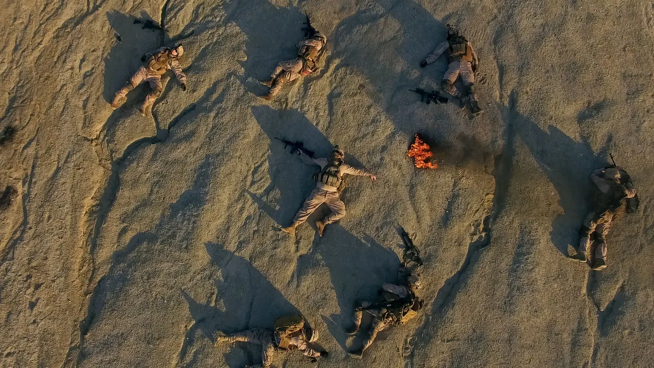 image of soldiers in Afghanistan around fire