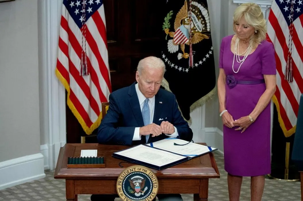 President Biden signs the Bipartisan Safer Communities Act into law, June 25, 2022. (STEFANI REYNOLDS/AFP via Getty Images)