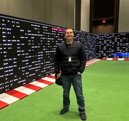 Chris Ebert standing in the Sports Expo space at Caesars Forum during AWS re:Invent 2025.