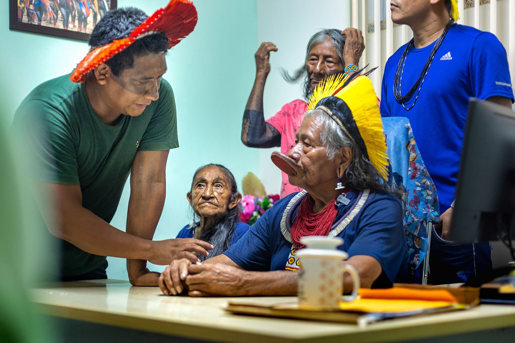Indigenous people talk at the table