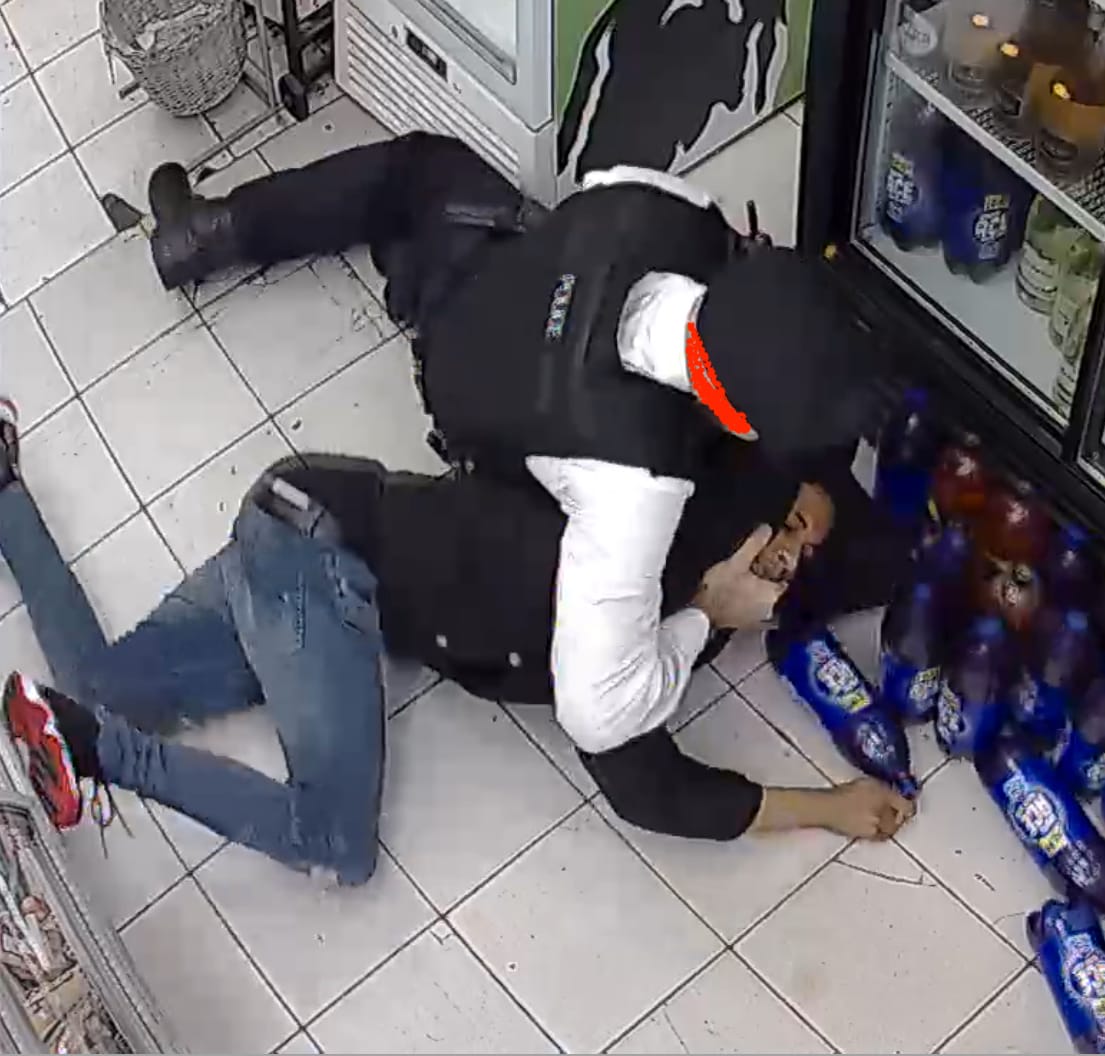 Officer’s hand goes to Charles Rashan’s mouth