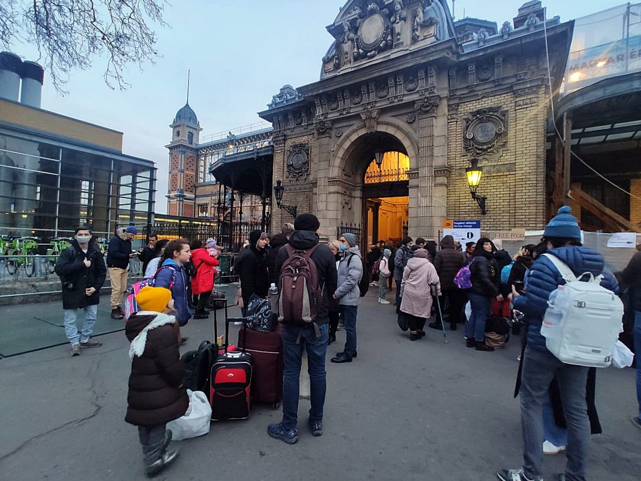 Refugees from Ukraine queue outside a Budapest train station