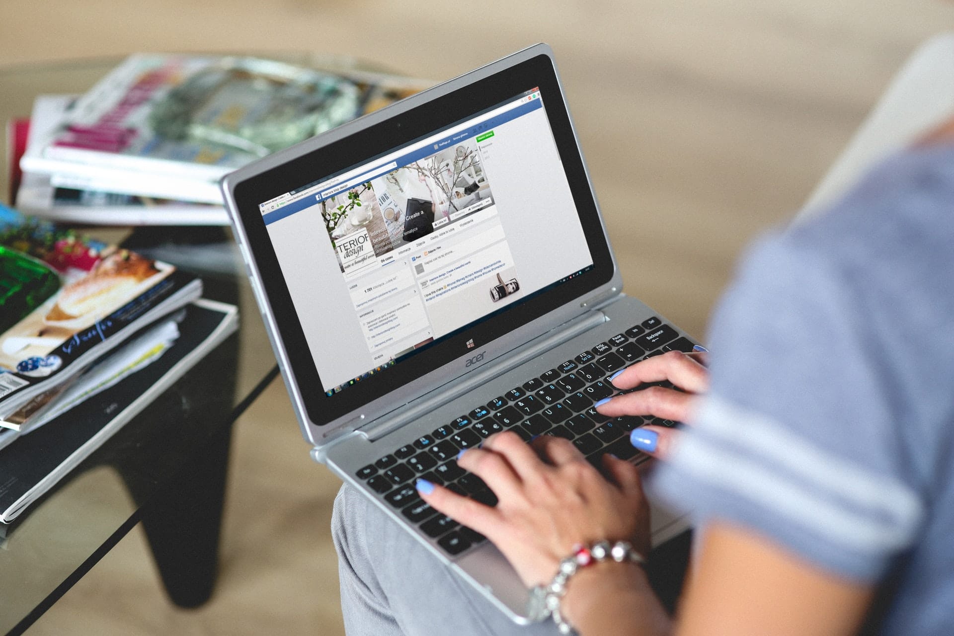 Woman typing on laptop computer