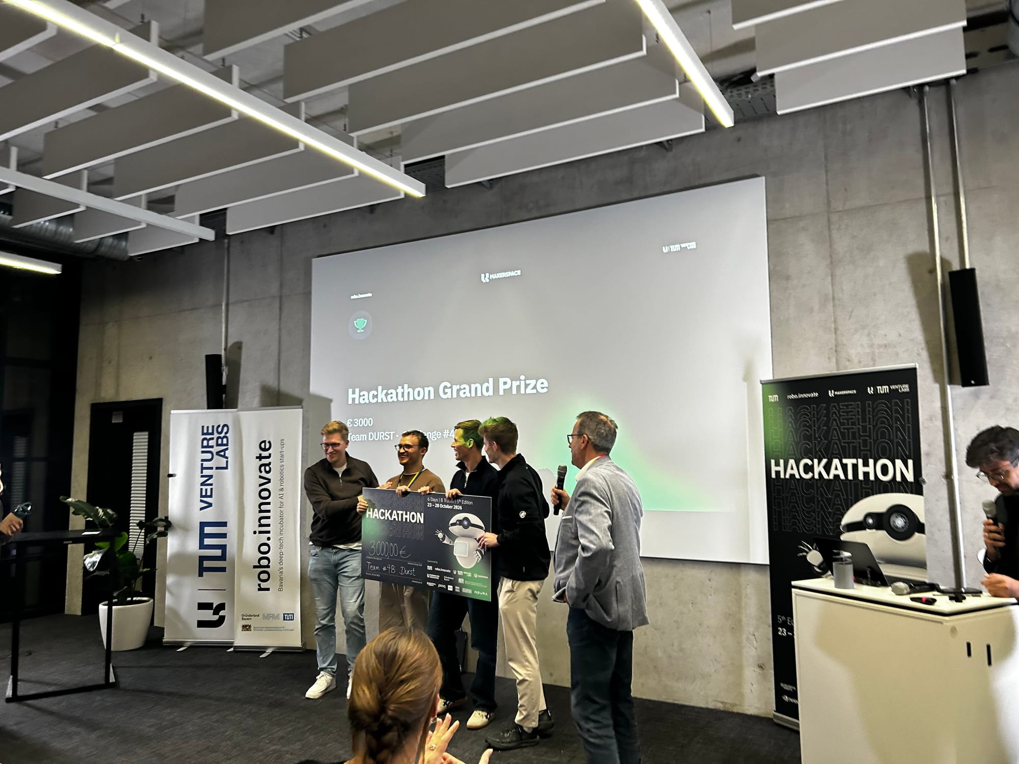 Team Durst receives the Hackathon Grand Prize on stage at robo.innovate 2026
