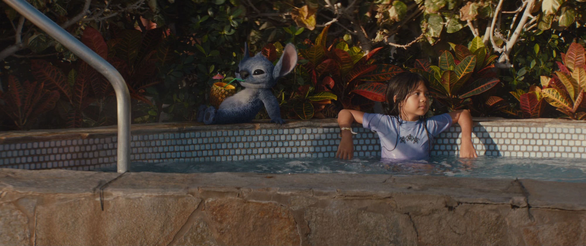 Stitch (voiced by Chris Sanders) and Lilo (Maia Kealoha) in Lilo & Stitch