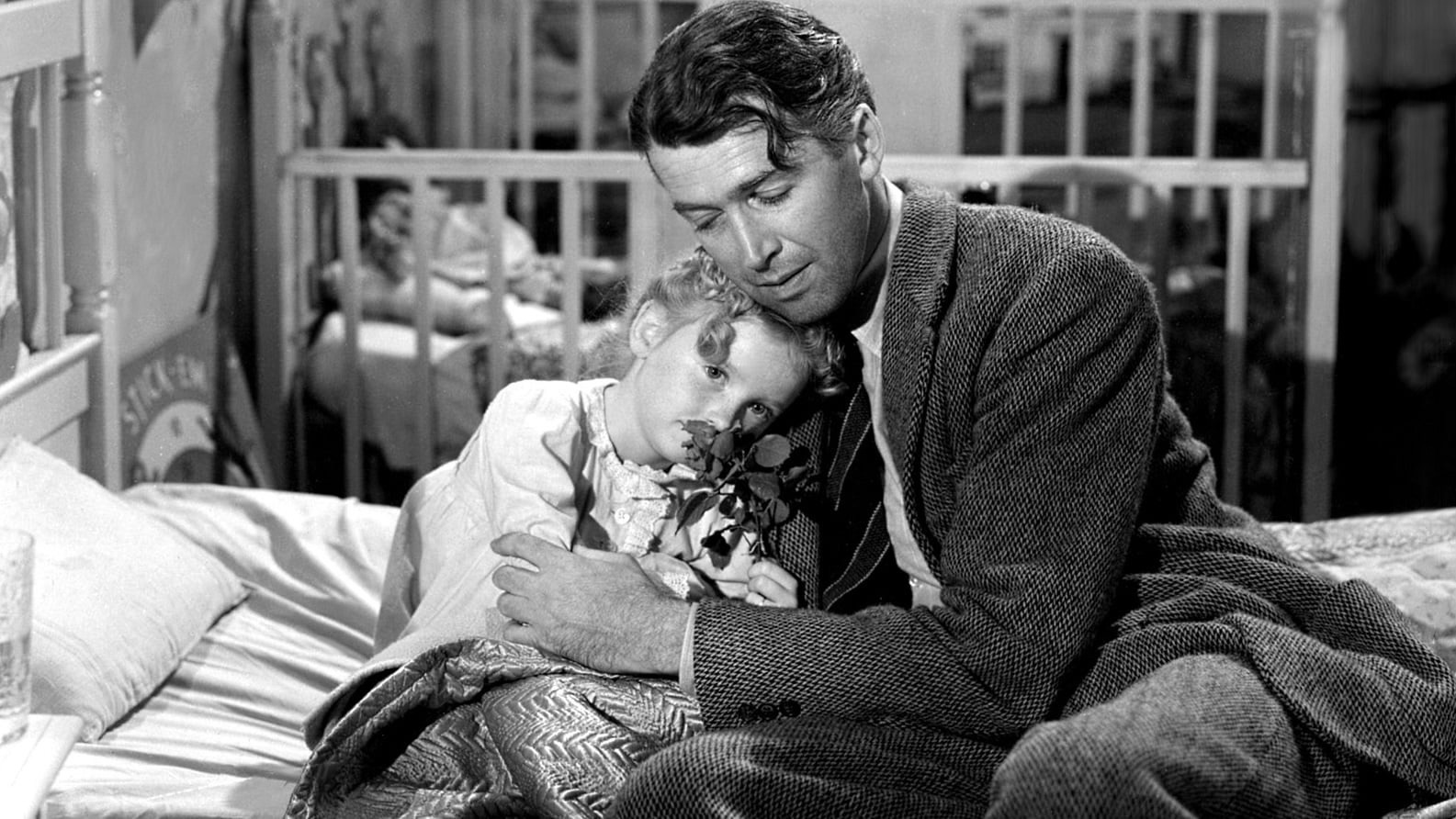 Zuzu (Karolyn Grimes) and George Bailey (James Stewart) in It’s a Wonderful Life