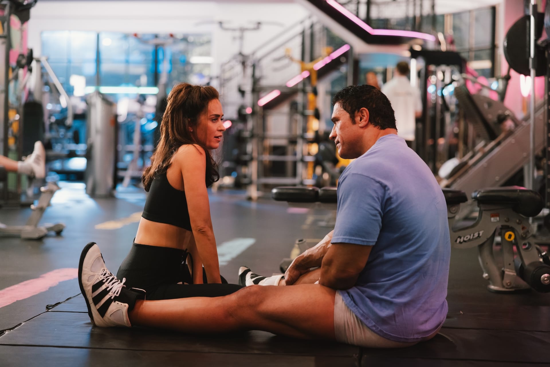 Emily Blunt as Dawn Staples and Dwayne Johnson as Mark Kerr in The Smashing Machine