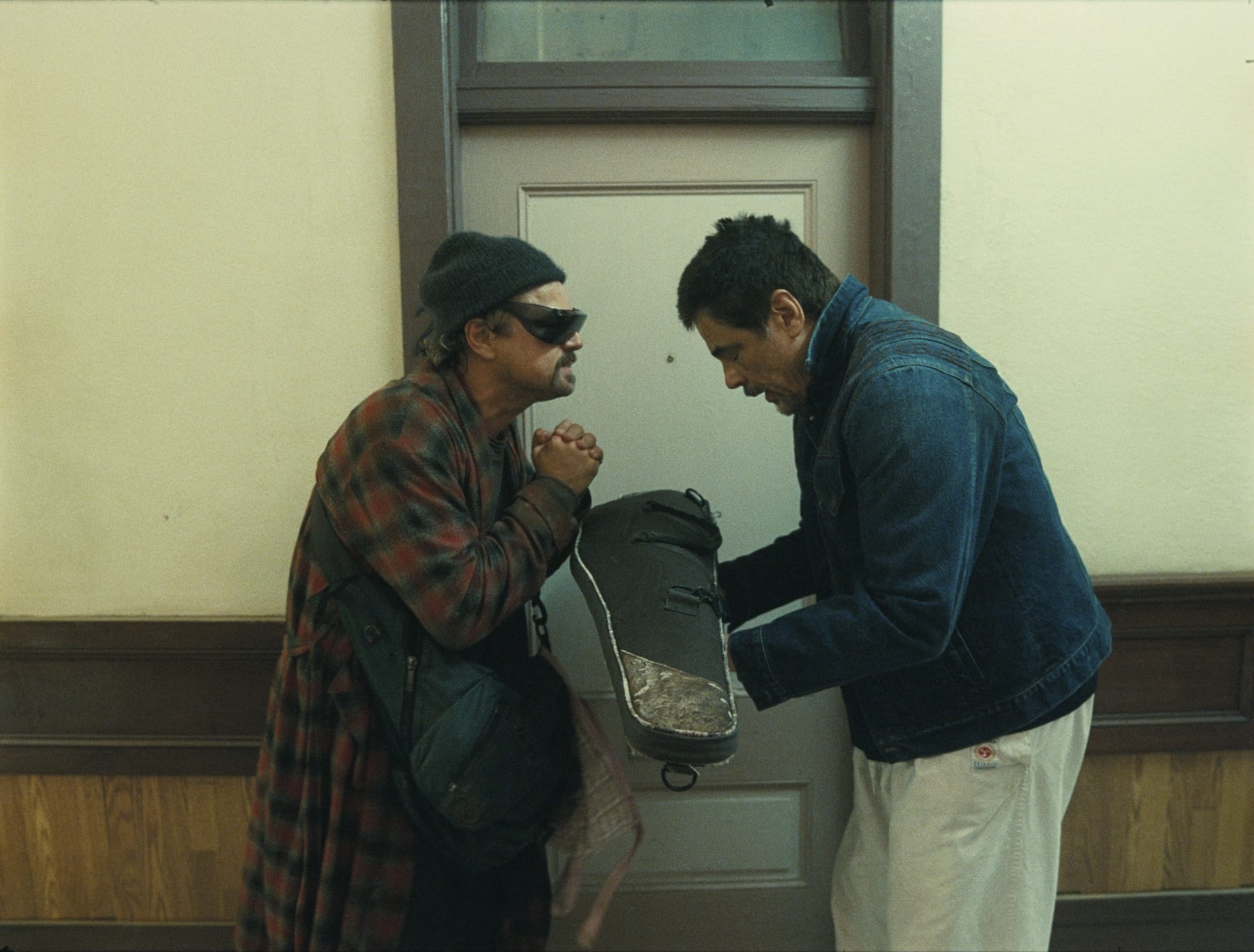 Leonardo DiCaprio as Bob Ferguson and Benicio del Toro as Sensei Sergio St. Carlos in One Battle After Another