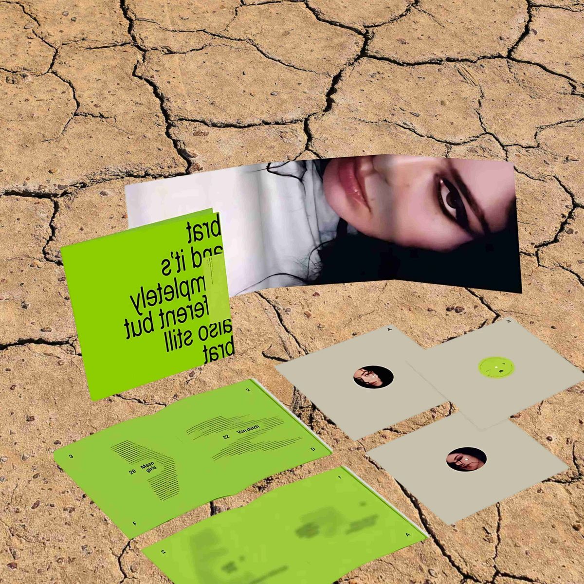 Limited-edition Charli XCX vinyl album displayed on cracked desert-like ground