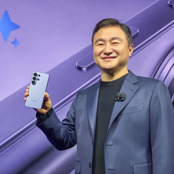Samsung executive holding Galaxy S26 Ultra on stage at Galaxy Unpacked 2026