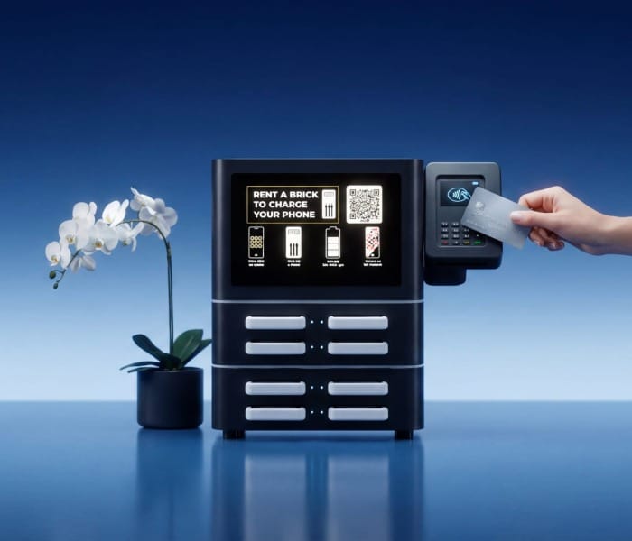 Brick Core+ tabletop power bank sharing station with an 8-inch LCD screen and integrated card terminal