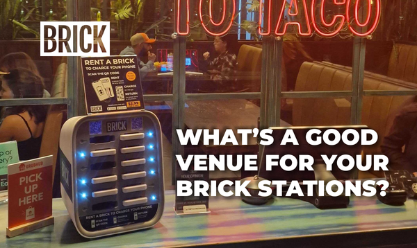 Brick 12 slot powerbank sharing station on a front desk in a taco restaurant