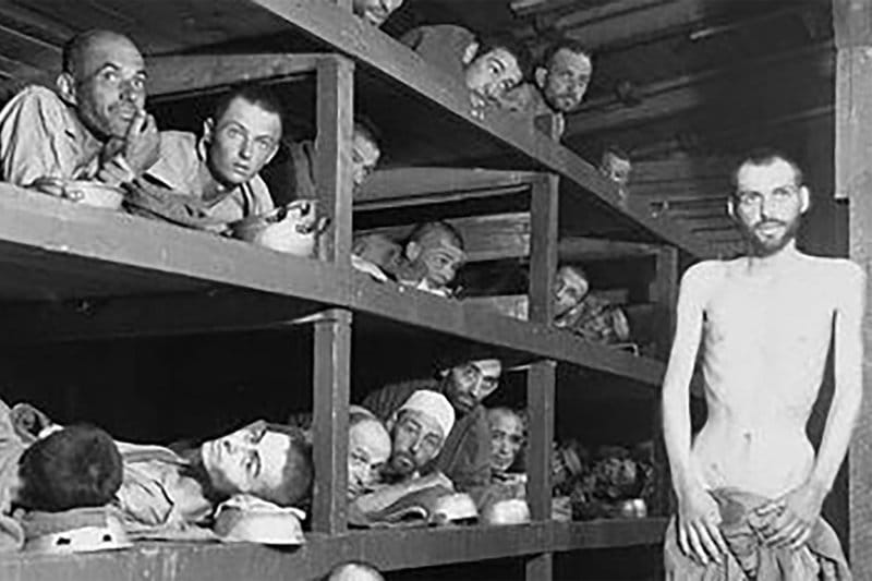 In this photo provided by the U.S. Army, inmates of the German KZ Buchenwald are seen inside their barracks a few days after U.S. troops liberated the concentration camp near Weimar, Germany on April 16, 1945.  It looks eerily like photographs of El Salvador's prison camps.