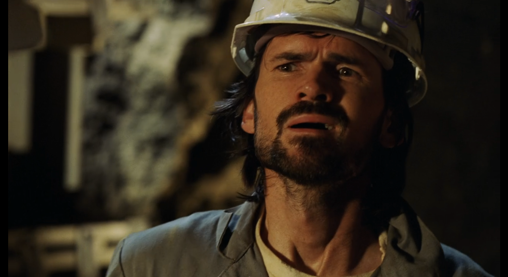 Daniel Faraday in a hard hat in the 1970s Orchid dig.
