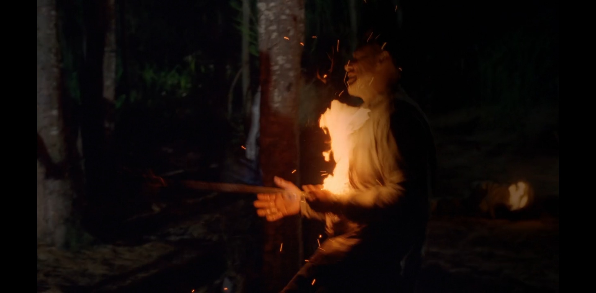 An unnamed Oceanic survivor is hit by a flaming arrow.