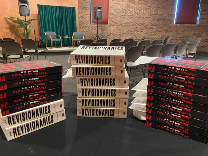 Stacks of copies of Very Fine People and The Revisionaries.