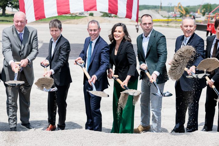 Governor Whitmer, Sam Altman, and others digging at a groundbreaking photo-op in Saline MI.