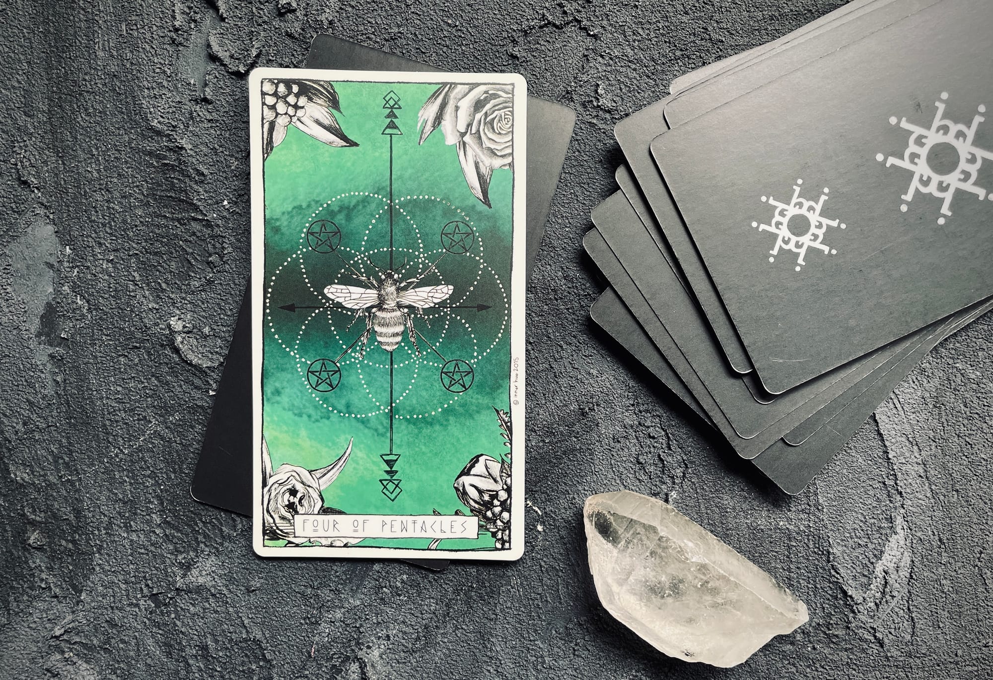 four of pentacles from the lumina tarot