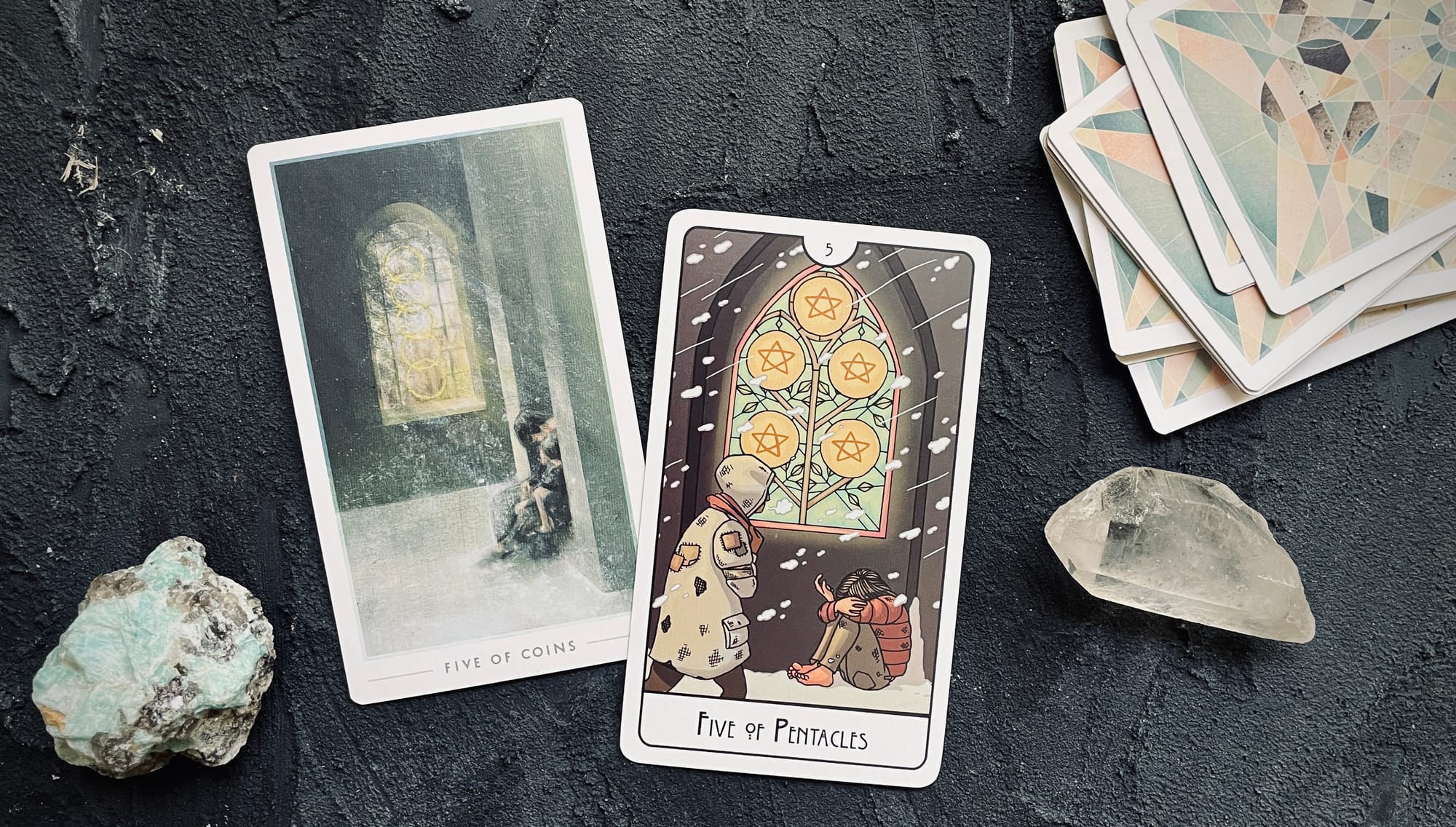 five of pentacles from the fountain tarot (left) and the this might hurt tarot (right)