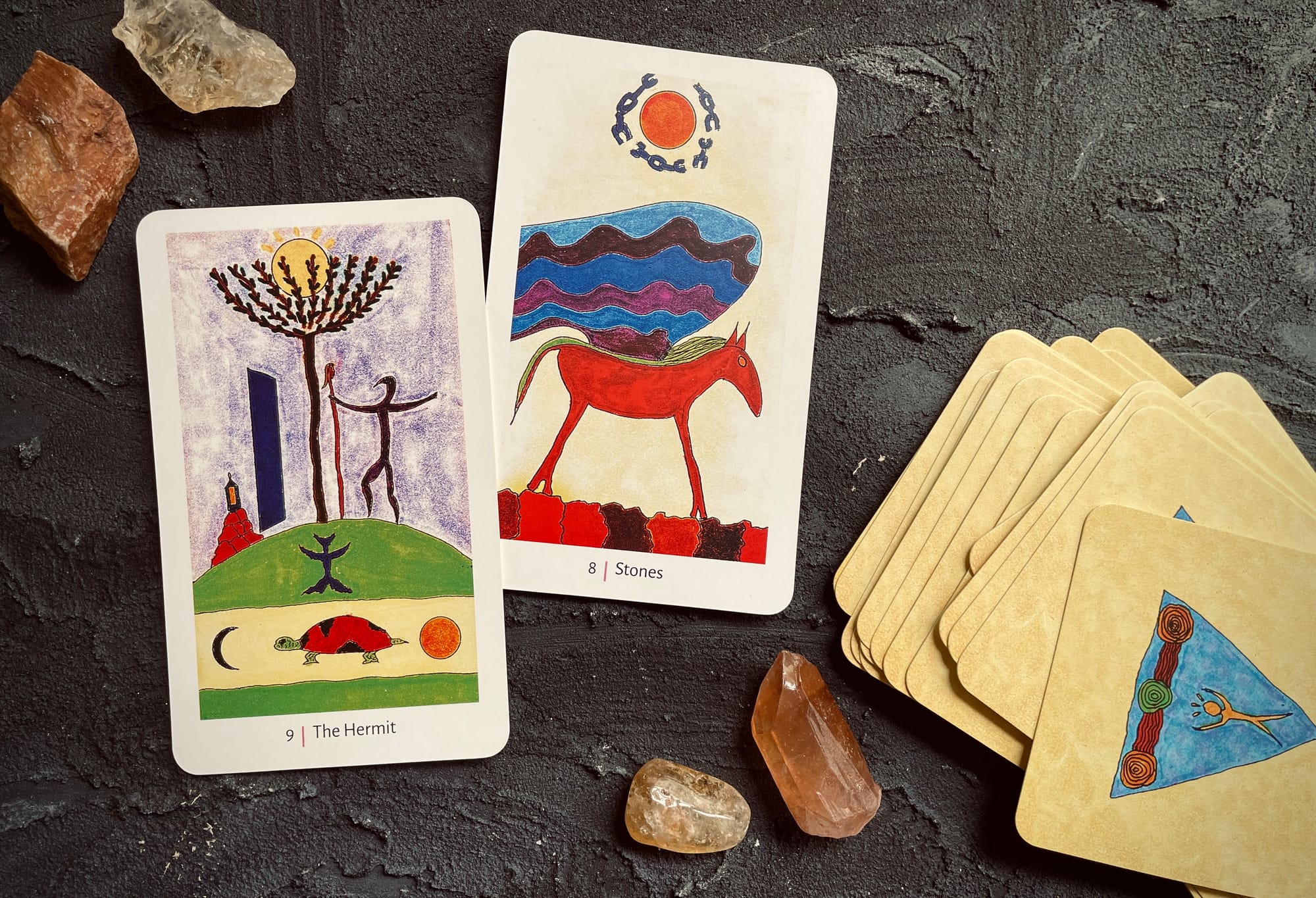 eight of stones & the hermit from the shining tribe tarot