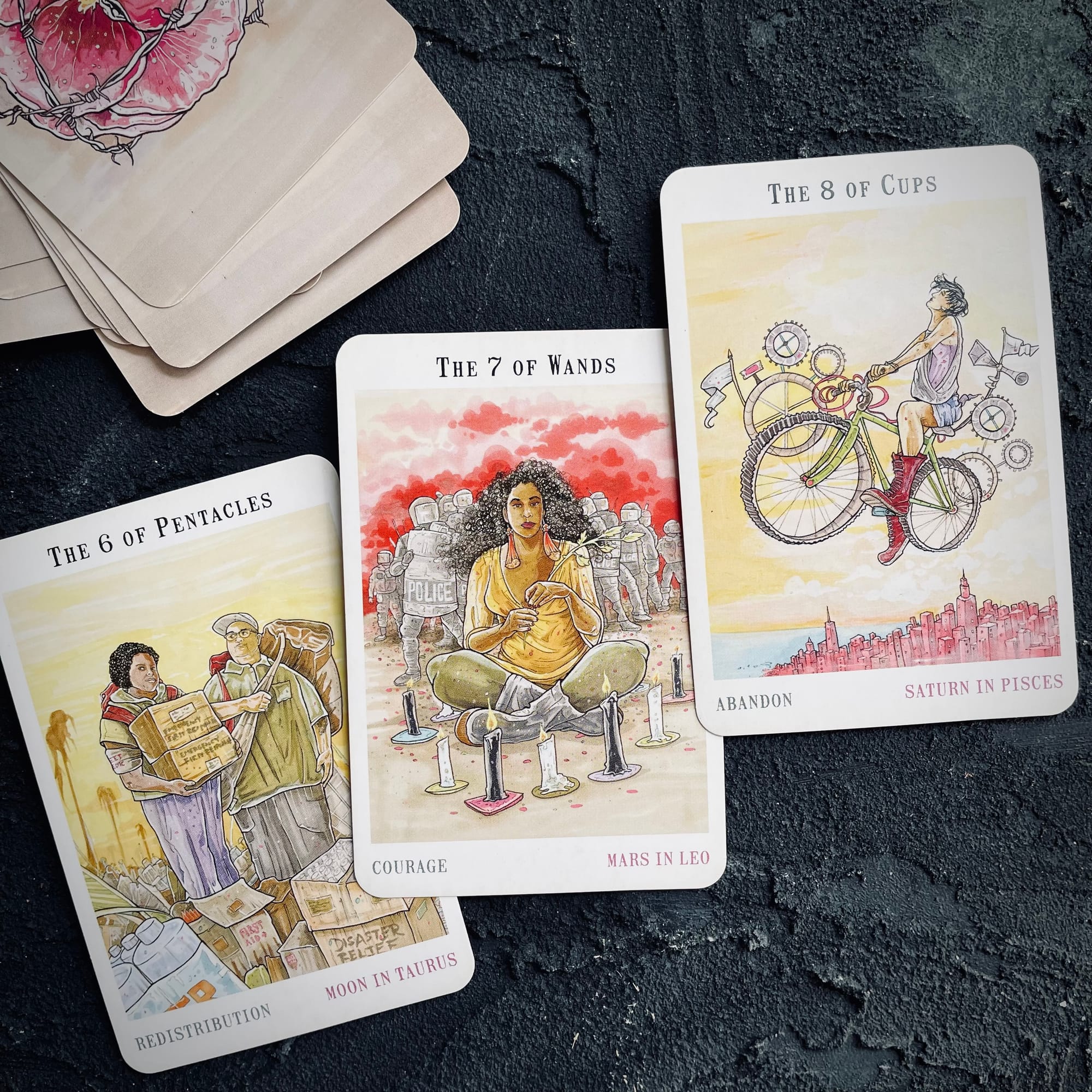 six of pentacles, seven of wands, and eight of cups from the next world tarot