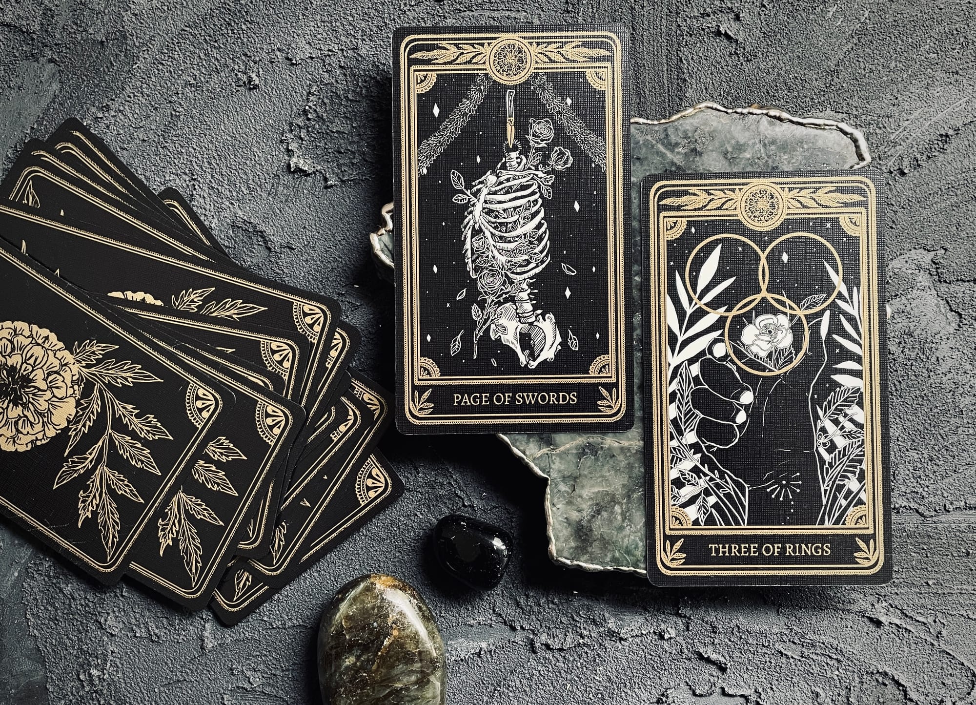 page of swords and three of pentacles from the marigold tarot