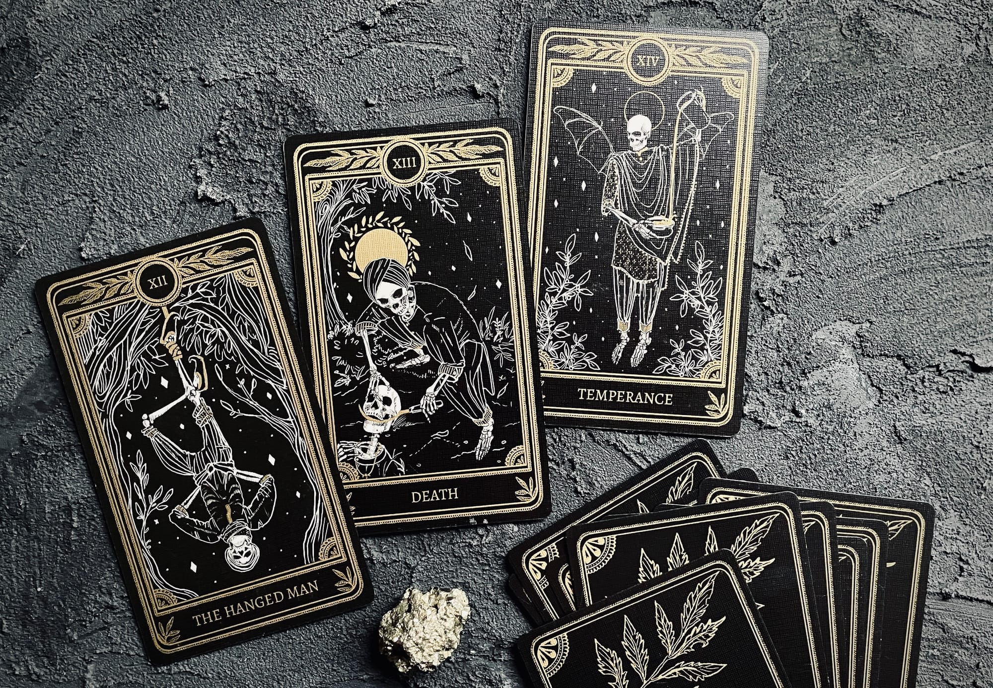 hanged one, death, and temperance from the marigold tarot