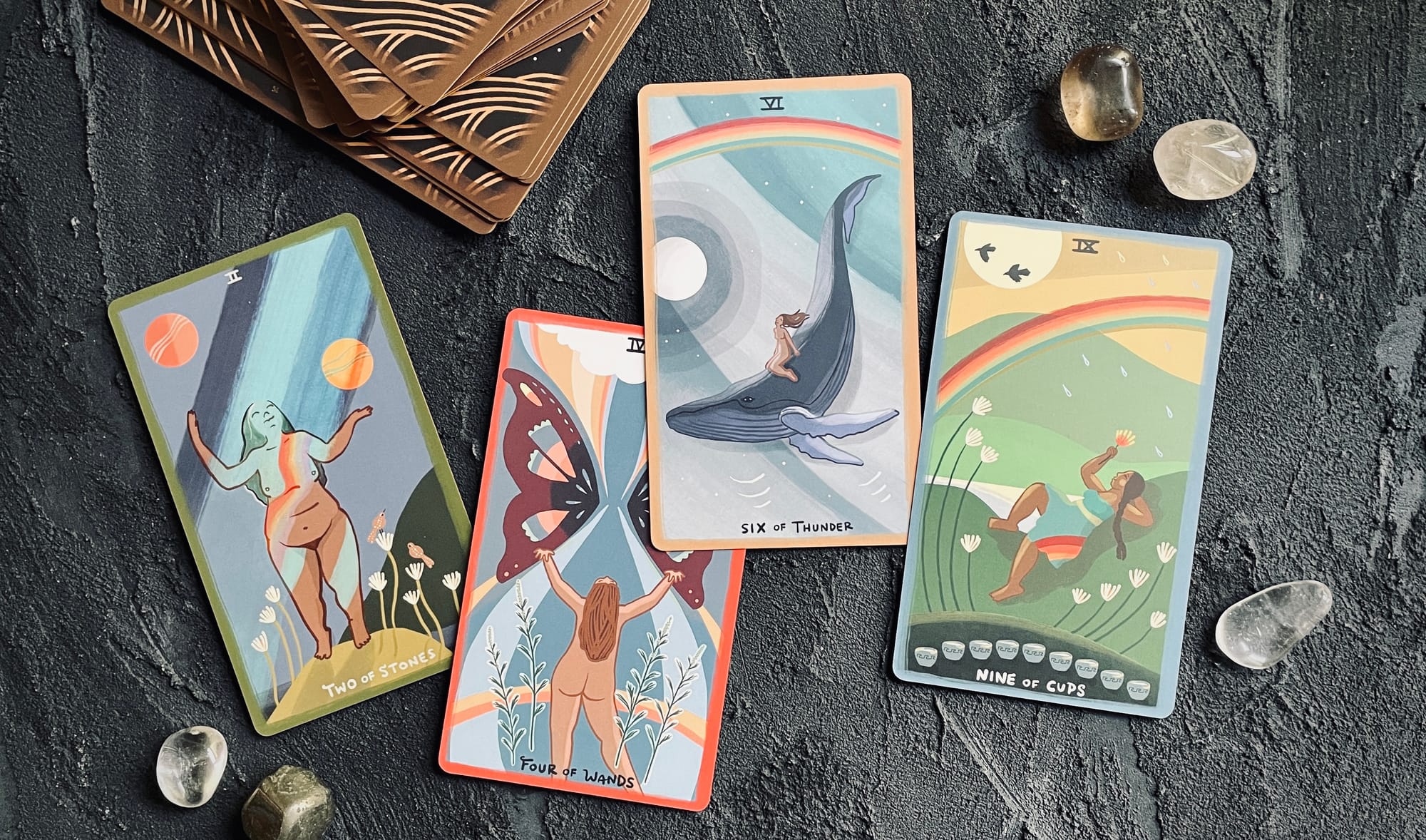 two of stones, four of wands, six of thunder, and nine of cups from the gentle tarot