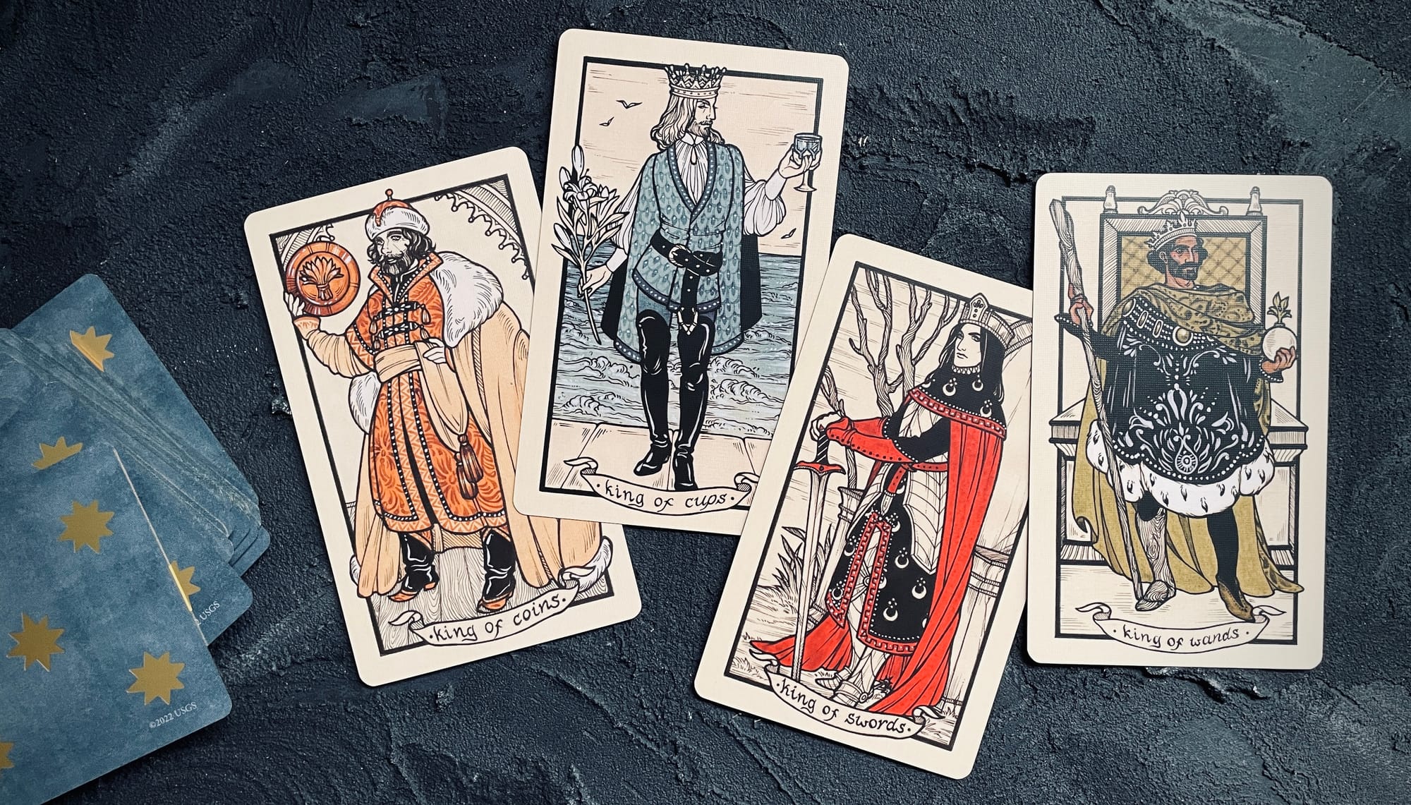 (left to right) king of coins, king of cups, king of swords, and king of wands from the fyodor pavlov tarot