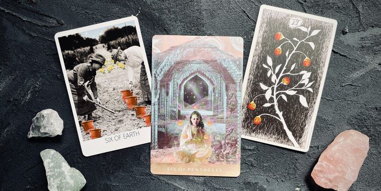 six of pentacles from the rosebud tarot (left), moonchild tarot (center), and wild unknown tarot (right)