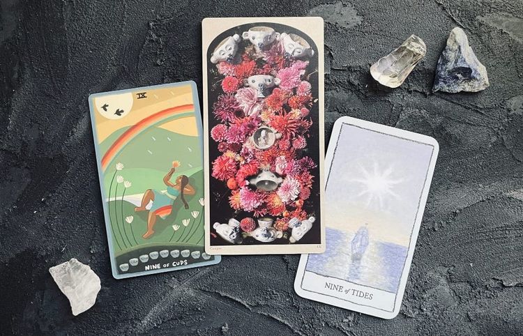 nine of cups from the gentle tarot (left), tarot of the drowning world (center), and mindscapes tarot (right)