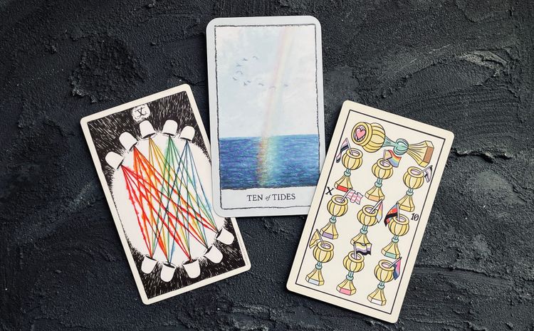 ten of cups from the wild unknown tarot (left), mindscapes tarot (center), and gay marseille (right)