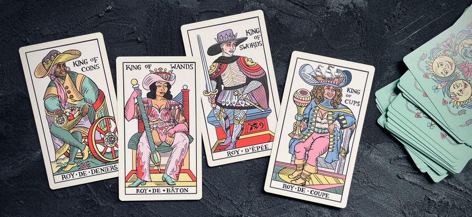 (left to right) king of coins, king of wands, king of swords, and king of cups from the gay marseille tarot