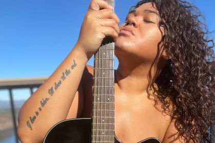 Indigenous intuitive healer ascends to her higher self by lifting up others
