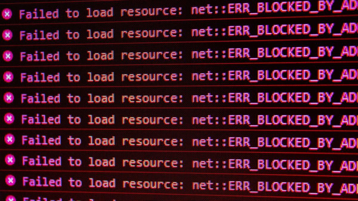 A computer screen showing the error "X Failed to load resource: net :: ERR_BLOCKED_BY_AD" repeatedly
