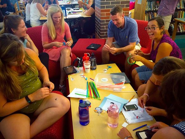 A group of adults learning to build bristlebots