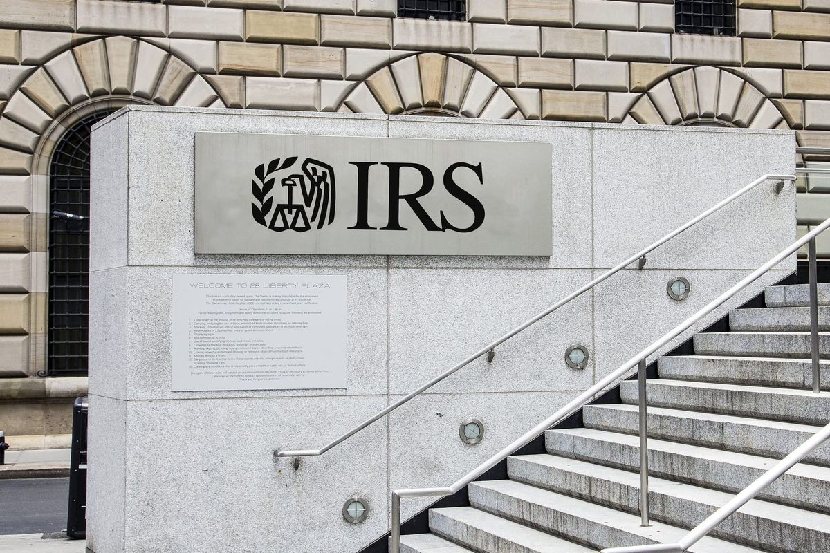 A stairway outside a government building with a sign reading IRS