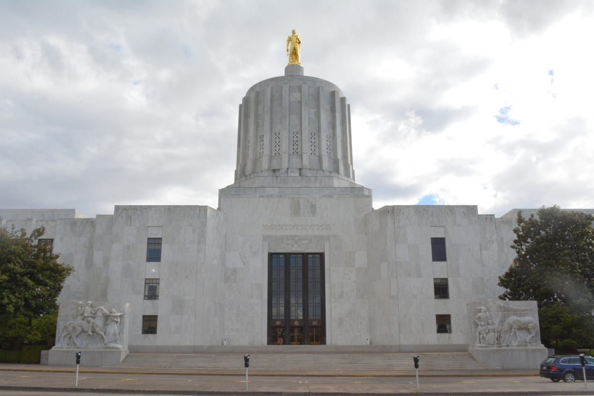 The Oregon state capitol building with clouds in the background