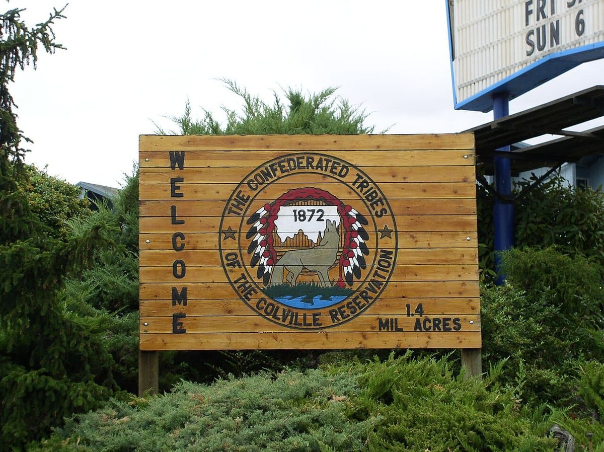 A sign welcoming visitors to the Confederated Tribes of the Colville Reservation, which it says encompasses 1.4 million acres.