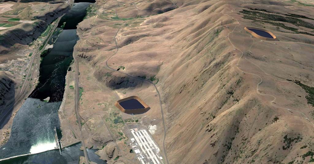 A gravity-fed energy generation project alongside a dam in a dry landscape.