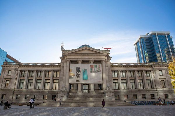 The front facade of the Vancouver Art Gallery with a banner for an exhibit that reads: Modern in the Making.
