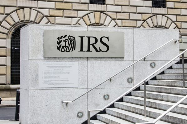 A stairway outside a government building with a sign reading IRS