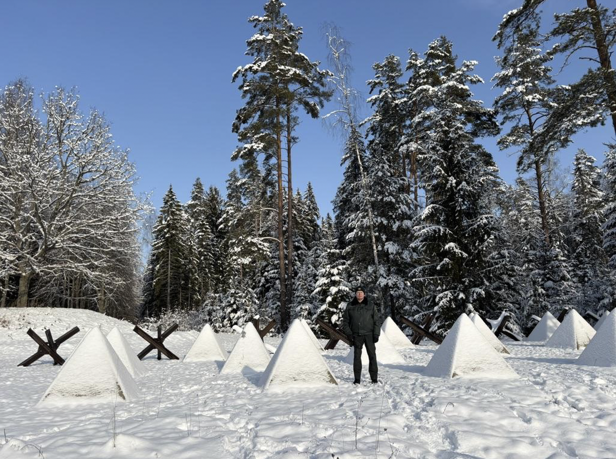 Mazurs at the Green border while giving a tour and standing among the tank traps. 