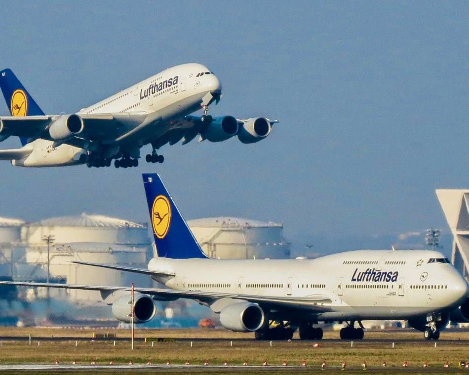 An Airbus A380 above a Boeing 747, both from Lufthansa airline at the airport in Frankfurt, Germany