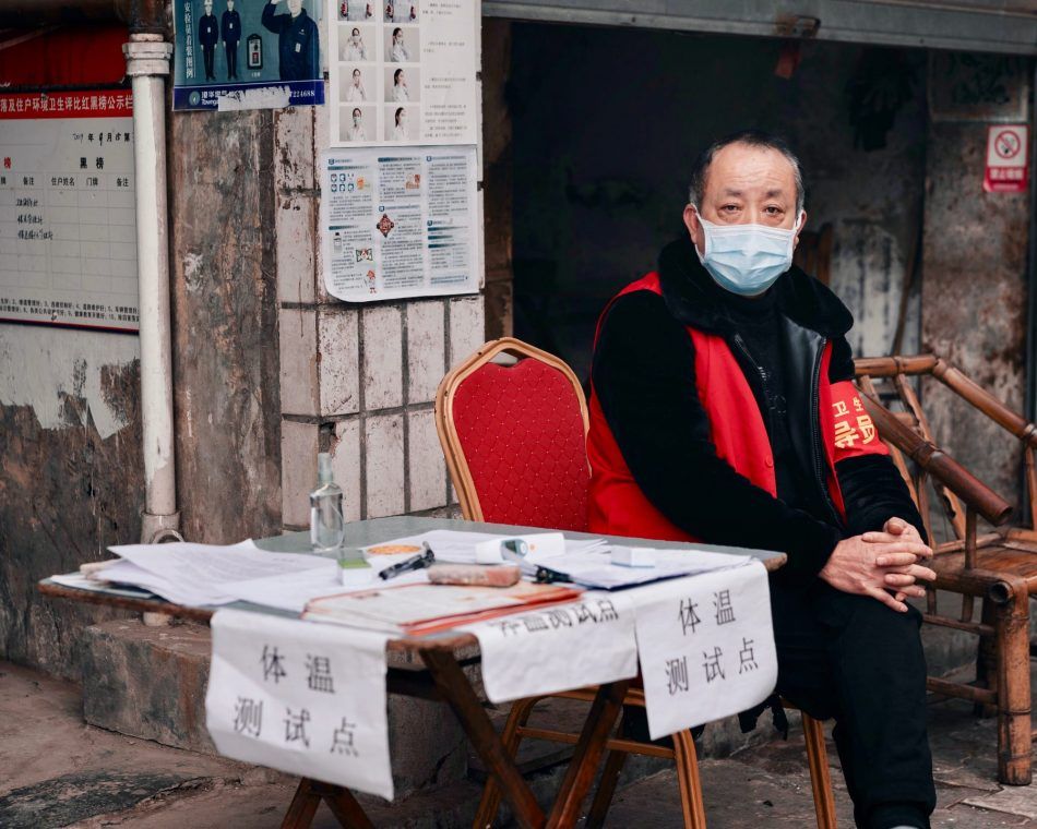In China's Sichuan province, staff on each street register temperature checks