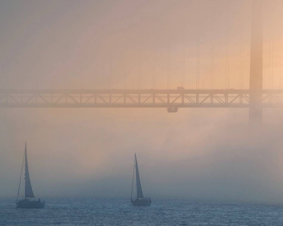 Fog over Lisbon's Tagus River, a heavily used and climate-challenged resource