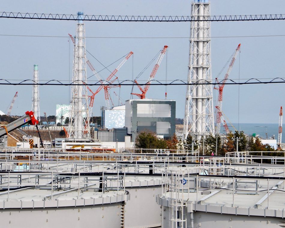 Water tanks with contaminated water in front of the reactor buildings at Japan's Fukushima Daiichi